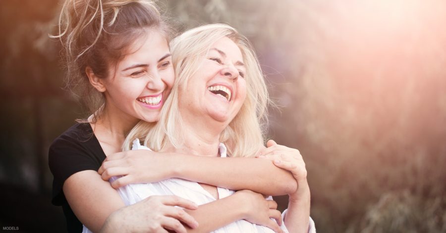A young woman hugging her mother